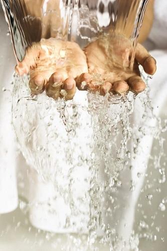 Water pouring over two hands